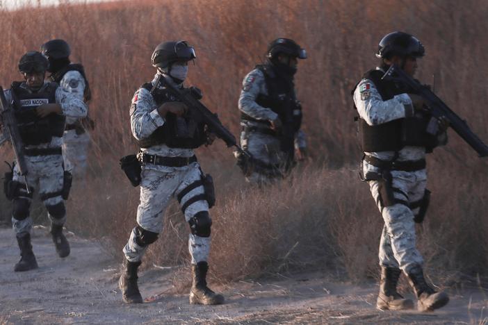 Mexican National Guard members patrol along the Mexico-US border in Ciudad Juarez on Wednesday.