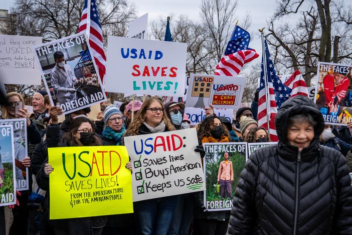 Hundreds of people gathered near the Capitol to protest the dismantling of USAID, the international agency charged with dispensing humanitarian aid around the world on behalf of the United States.