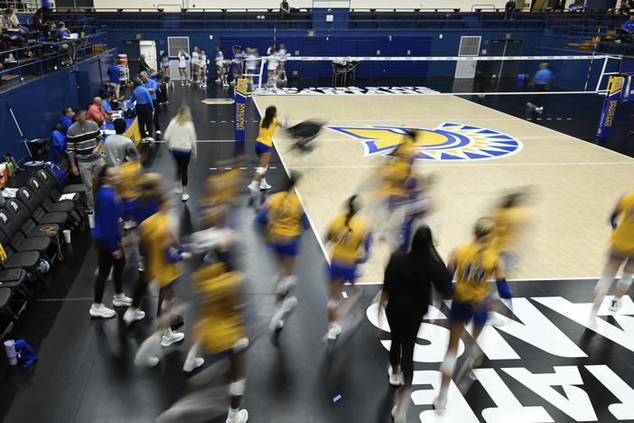 The San Jose State players take the court for warm-ups before an NCAA women's college volleyball match against Air Force on Oct. 31, 2024, in San Jose, Calif.