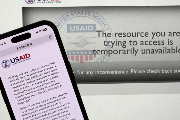 In this photo illustration, a message appears on the U.S. Agency for International Development (USAID) website on Feb. 5. The Trump administration issued a directive late Tuesday night that all USAID direct hire personnel will be placed on administrative leave globally Friday at midnight.