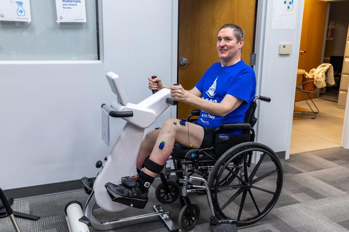 Research participant Doug McCullough uses the adaptive exercise bike during a testing session at the University of Pittsburgh.