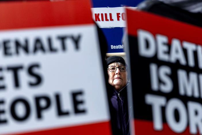 Michigan resident Beverly Leaf stands in solidarity with the mother of Demetrius Frazier as she pleads for Gov. Gretchen Whitmer to bring him to Michigan to serve out a life sentence.