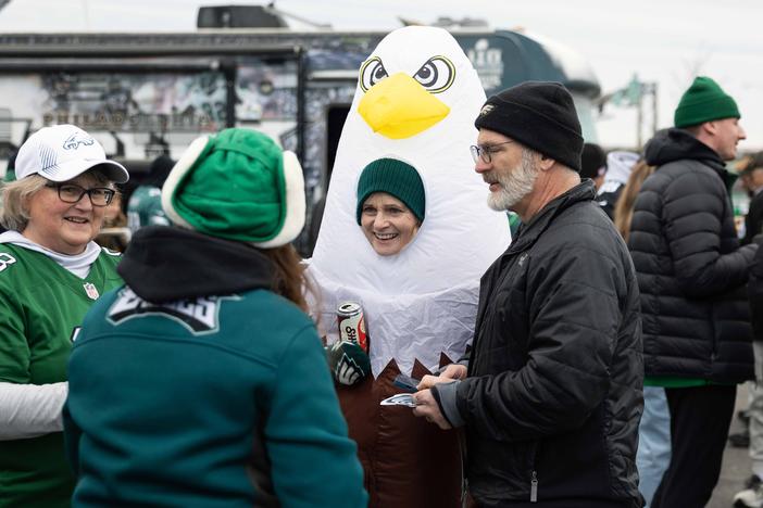 Susan Klabunde (center) dons an eagle costume at a tailgate before the NFC championship game at Lincoln Financial Field in Philadelphia.