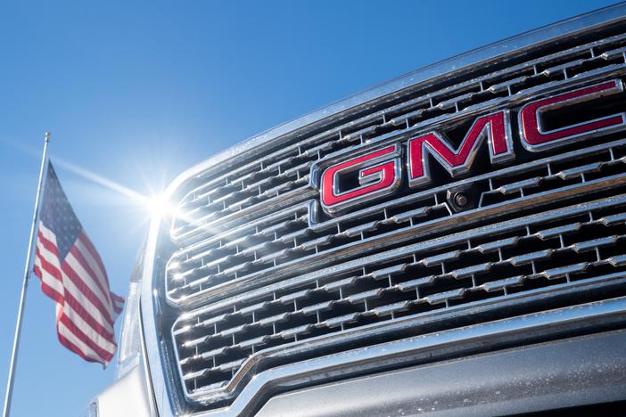 A GMC pickup truck is displayed for sale on a lot at a General Motors dealership in Austin, Texas. Last year, General Motors told investors in its annual report that "we are committed to fostering a culture of diversity, equity and inclusion." But in its latest report, published last week, GM doesn't mention diversity once.