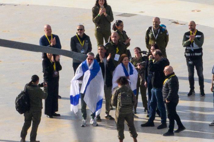 Released hostage Ohad Ben Ami draped in an Israeli flag arrives at Tel Aviv Sourasky Medical Center - Ichilov Hospital by helicopter, on Feb. 8, in Tel Aviv, Israel.