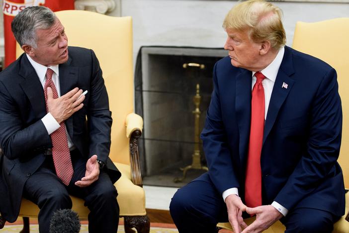 Jordan's King Abdullah II (L) speaks to U.S. President Donald Trump before a meeting in the Oval Office of the White House June 25, 2018 in Washington, DC.
