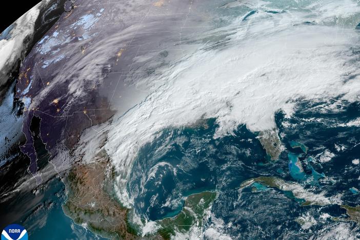 <strong>There's a country under here somewhere:</strong> A satellite image from early Tuesday shows a thick glaze of white clouds covering much of the continental U.S., with another storm system looming off the Pacific Coast.