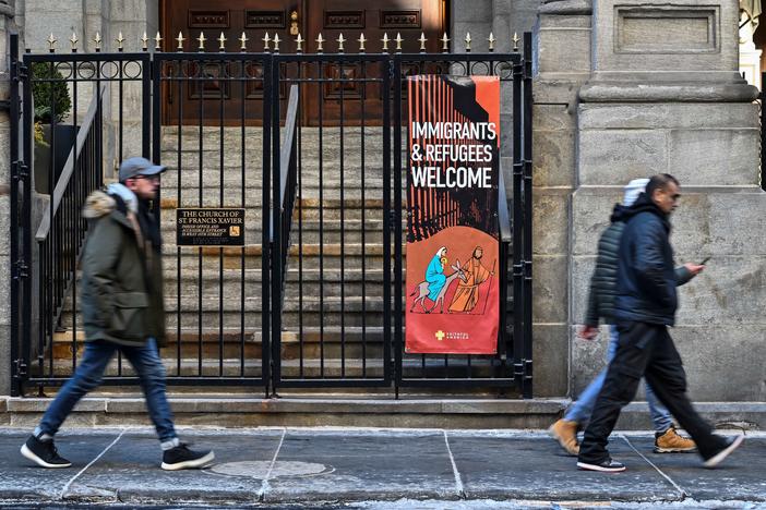 A church displays a sign saying, "Immigrants & Refugees Welcome" in New York.
