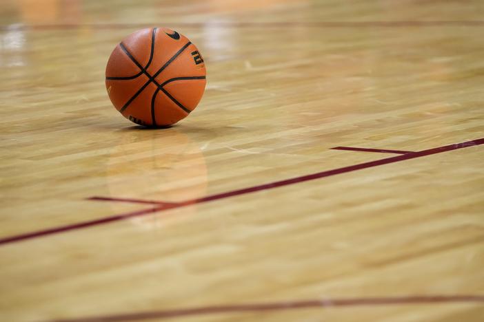 A basketball sits on the court during the first half of an NCAA college basketball game Jan. 21 in Ames, Iowa.