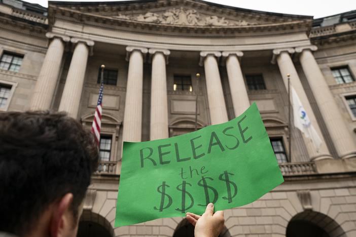 A demonstrator shows opposition during a demonstration at the Environmental Protection Agency on Feb. 6 in Washington, DC.