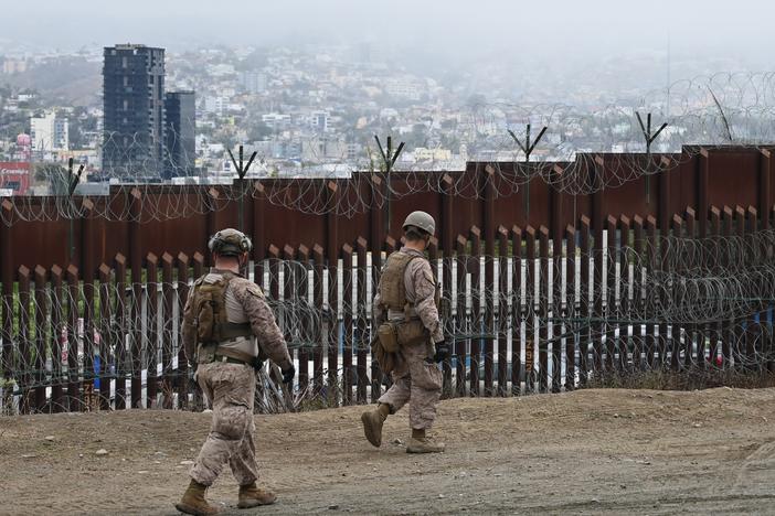 Members of the U.S. Marine Corps patrol the U.S.-Mexico border area as seen from San Diego on Feb. 7.