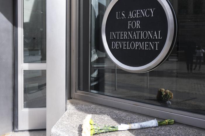 A bouquet of white flowers placed outside the headquarters of the United States Agency for International Development, or USAID, is pictured on Feb. 7, 2025, in Washington.