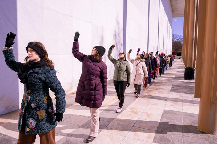 Performers dance outside of the Kennedy Center in Washington, D.C., on Monday. The dance was part of a protest against new leadership by President Trump.