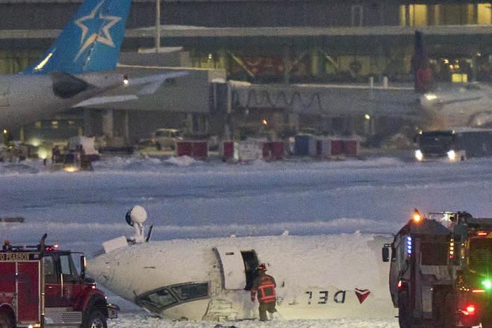 A Delta air Lines plane sits on its roof after crashing upon landing at Toronto Pearson Airport in Toronto, Ontario, on Feb. 17, 2025.