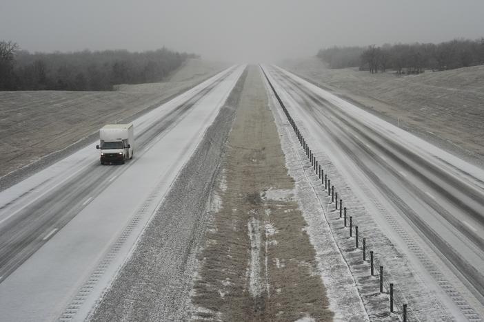 A truck drives along Interstate 335 during a winter storm, Tuesday, Feb. 18, 2025, near Luther, Okla.