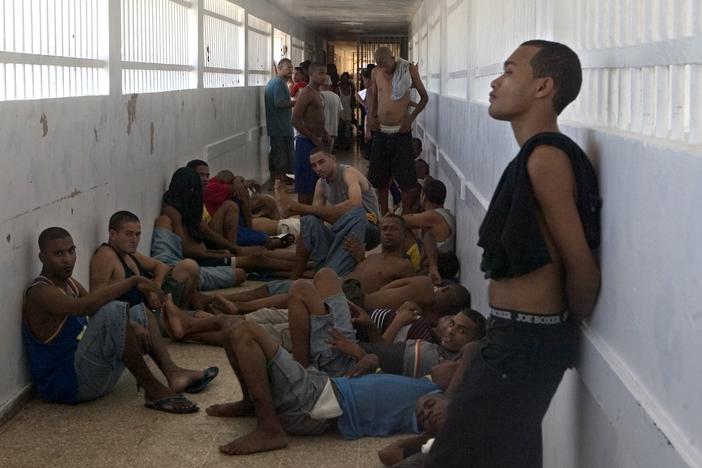 Inmates stand inside a corridor during time they are allowed to be outside of their cells at Najayo jail in San Cristobal, west of Santo Domingo in 2007.