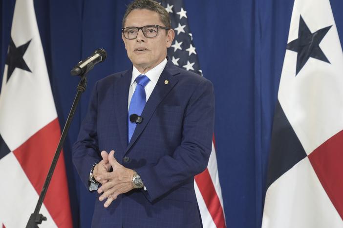 Panama's Minister of Public Security Frank Alexis Abrego, speaks to reporters after watching people board a repatriation flight bound for Colombia at Albrook Airport in Panama City on Feb. 3.
