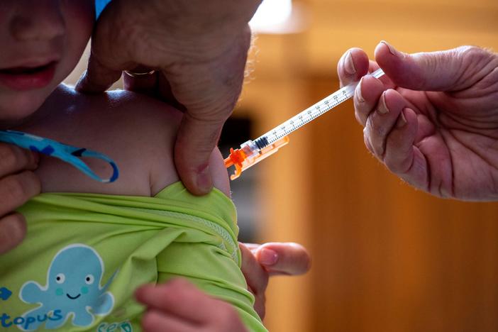 A 3-year-old receives a COVID-19 vaccine on June 21, 2022.