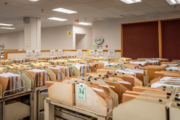 The IRS says it processed 11.7 million tax returns in the first week of the 2025 filing season. Here, carts loaded with documents are seen at an IRS processing facility in Austin, Texas, last September.