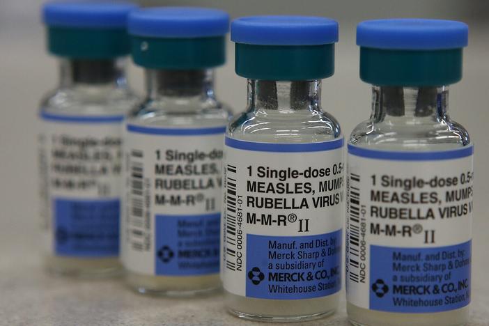In this photo illustration, vials of measles, mumps and rubella vaccine are displayed on a counter at a Walgreens Pharmacy in California during an outbreak in 2015.