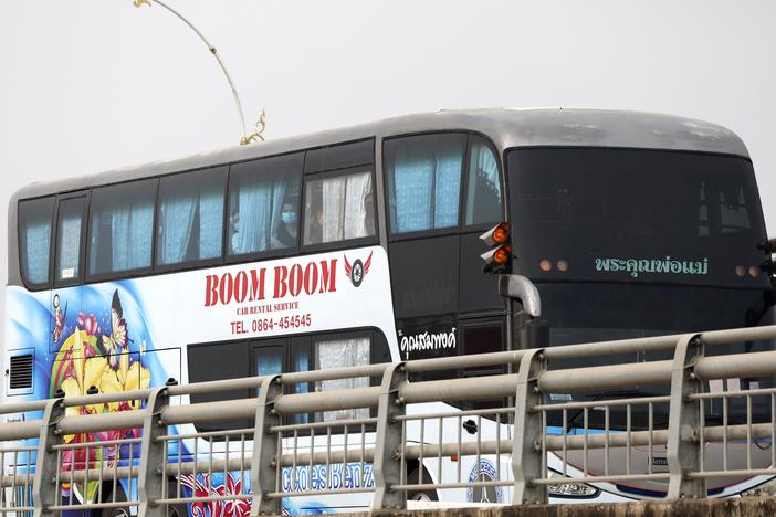 A bus, believed to be carrying Chinese nationals who have worked at scam centers in eastern Myanmar, crosses the 2nd Thai-Myanmar Friendship Bridge in Mae Sot in Thailand's Tak province before being flown back to China on Feb. 20, 2025.