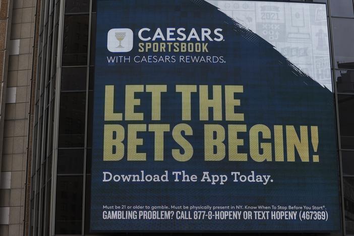 A Caesars Sportsbook gambling advertisement on the exterior of a building in New York City in 2024.