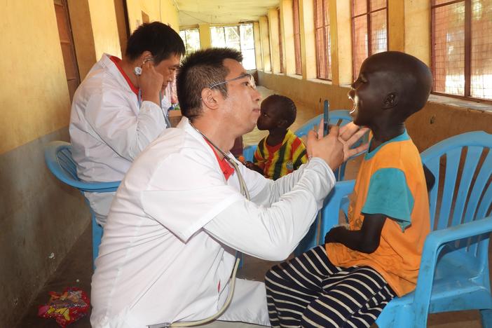 Doctors from a Chinese medical team examine children at the Juba Orphanage in South Sudan in September 2024 — part of China's effort to play a leading role in the world of global health.