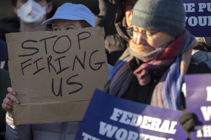 Demonstrators rally in support of federal workers outside of the Department of Health and Human Services in Washington, D.C. on Friday, amidst a wave of mass layoffs across the federal government.