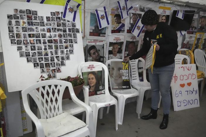 A poster shows Shiri Bibas, center, who was kidnapped to Gaza with her husband and two young sons on Oct. 7, 2023, in Jerusalem on Friday.