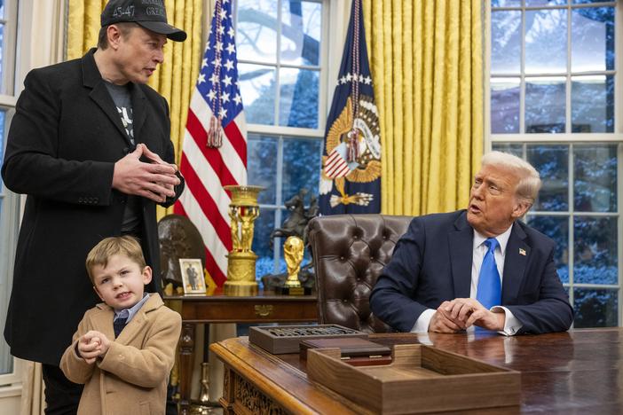 Tesla and SpaceX CEO Elon Musk with his son X Æ A-Xii and President Trump in the Oval Office on Feb. 11. Musk has been tapped by President Trump to lead federal cost-cutting efforts.