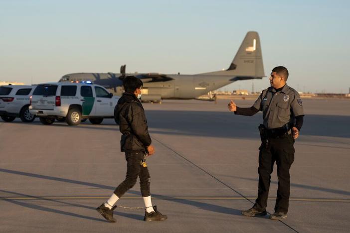 An immigrant prepares to board a military removal flight last month at Fort Bliss, near El Paso, Texas.