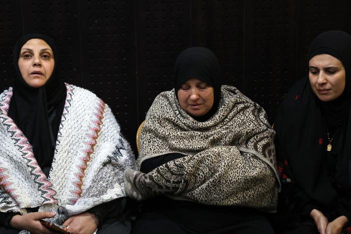 Palestinian families react after Israel delayed the release of Palestinian prisoners, scheduled to be released in the seventh hostage-prisoner exchange, in the occupied West Bank city of Ramallah early on February 23, 2025.