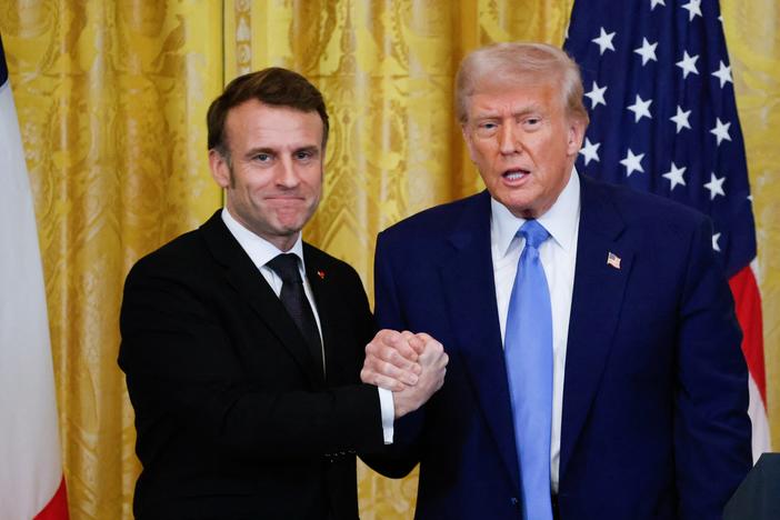 President Trump and French President Emmanuel Macron shake hands at the end of a joint press conference in the East Room of the White House on Monday.