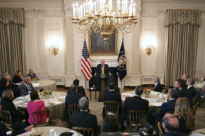 President Trump speaks with governors in the White House last week. He challenged Maine Gov. Janet Mills about her state's policy on transgender student athletes, prompting her to answer, "See you in court."