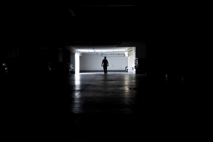 A man walks in a parking garage during a power outage, in Santiago, Chile, on Feb. 25, 2025.