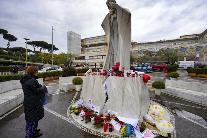 A woman prays for Pope Francis on Wednesdays in front of the Agostino Gemelli Polyclinic, in Rome, where the Pontiff has been hospitalized since Feb. 14.