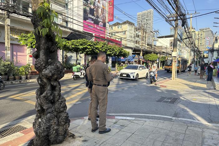 Police stand outside an immigration detention center of the Immigration Bureau where Uyghur detainees were held in Bangkok in January. The detainees said they were facing deportation back to China, where they fear persecution.
