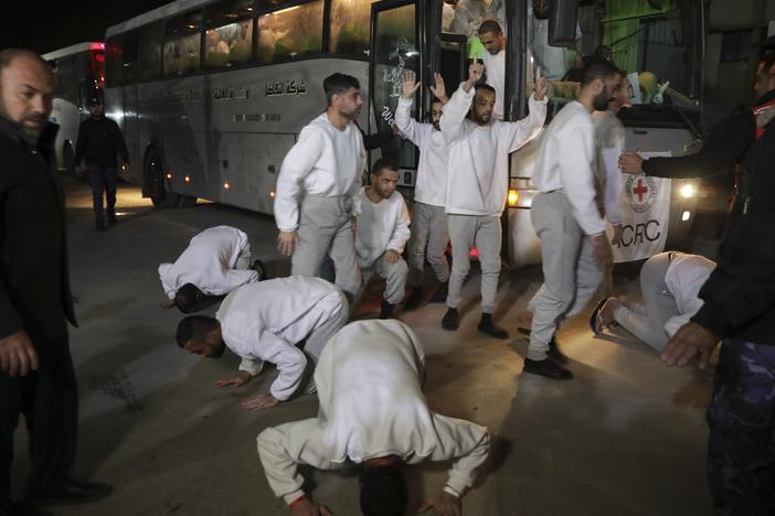 Freed Palestinian prisoners react as they arrive in the Gaza Strip after being released from an Israeli prison following a ceasefire agreement between Hamas and Israel in Khan Younis, Gaza Strip, on Thursday.