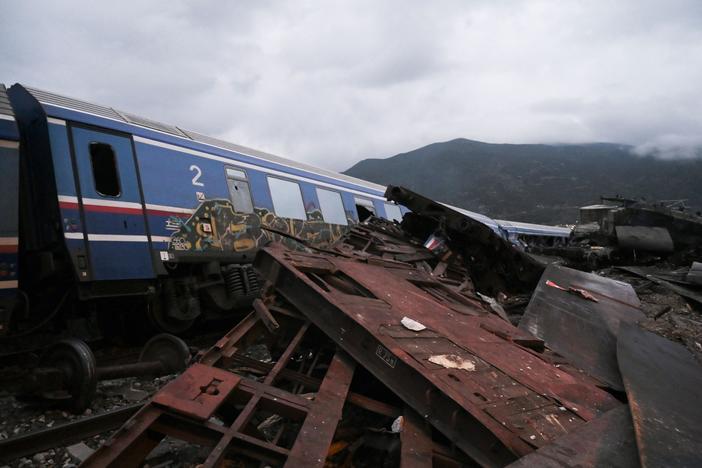 Wrecked wagons and mangled pieces of metal are seen near the tracks after a train accident in the Tempi Valley near Larissa, Greece, March 1, 2023.