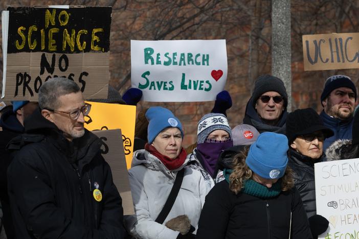 People protested funding cuts to research institutions at the University of Chicago last week.