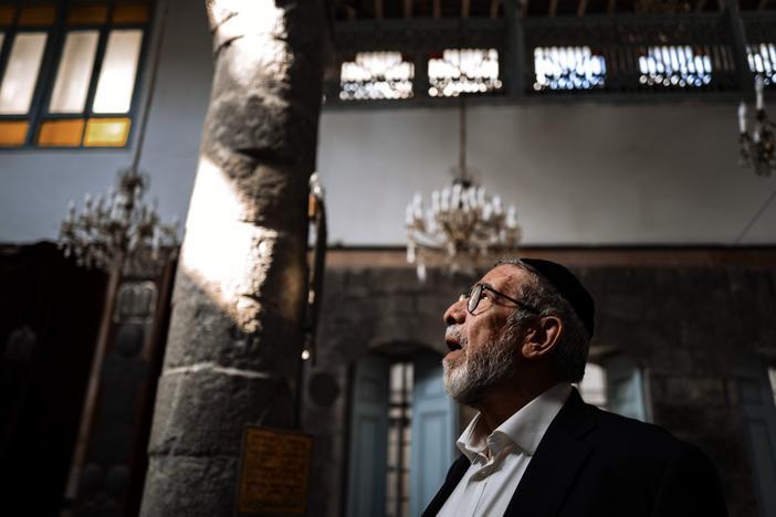 Rabbi Yusuf Hamra steps into the more than 500-year-old Faranj synagogue in Damascus for the first time in more than three decades. He left Syria, along with most of the country's historic Jewish population, in 1992.