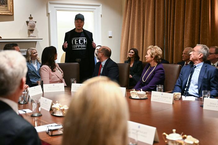 Leader of the Department of Government Efficiency Elon Musk wears a shirt that says "Tech Support" as he speaks during a cabinet meeting with US President Donald Trump at the White House in Washington, DC, on February 26, 2025.