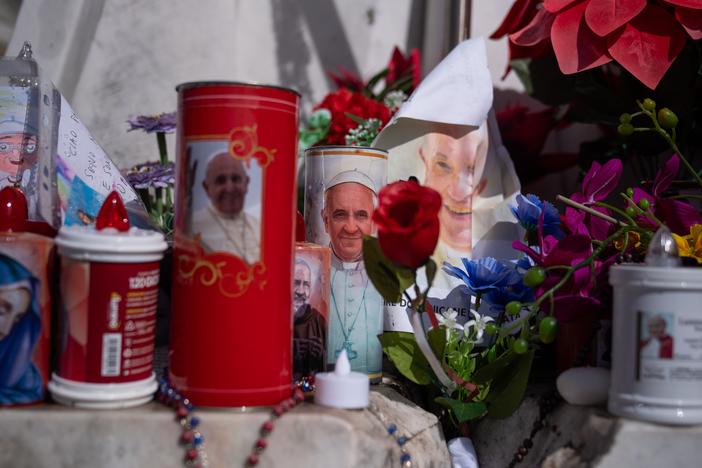 Flowers, balloons, candles and other items are laid outside Gemelli hospital in Rome, on Feb. 26, where Pope Francis is being treated.