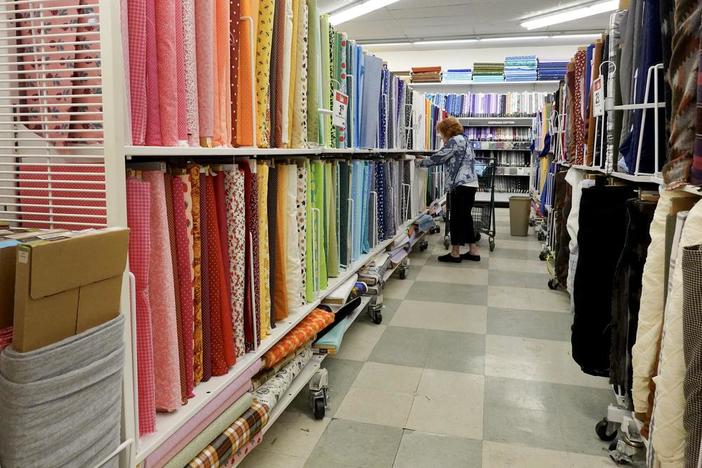 A customer shops in a Joann store in Miami on Feb. 13. The retailer announced last month that it is going out of business and closing its roughly 800 stores across the U.S.