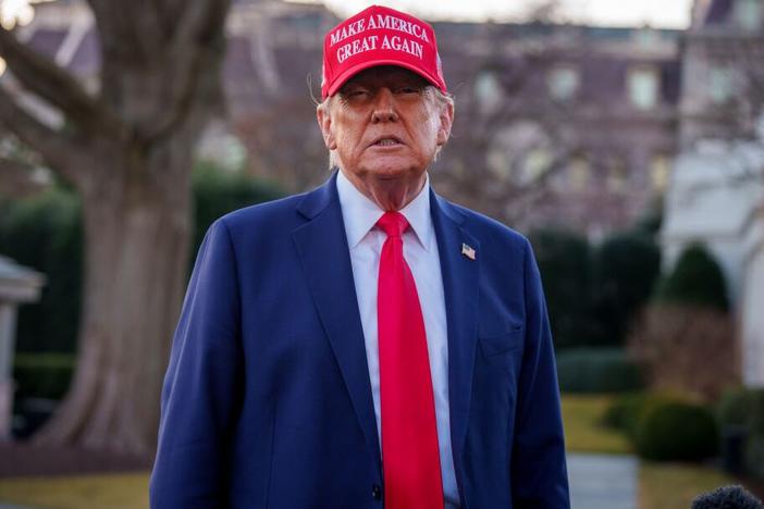 President  Trump takes a question from a reporter before boarding Marine One on the South Lawn of the White House on Friday.