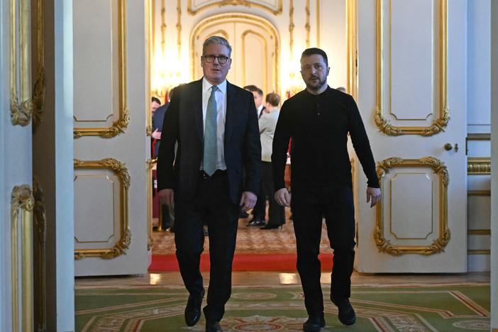 Britain's Prime Minister Keir Starmer (left) and Ukraine's President Volodymyr Zelensky (right) head to a private room to hold a meeting during a summit at Lancaster House on March 2 in London, England.