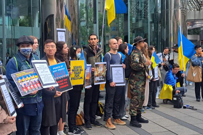 Members of the Ukrainian community in Taiwan, alongside Taiwanese supporters, gather outside Moscow's representative office in Taipei to protest the three-year anniversary of Russia's full-scale invasion of Ukraine