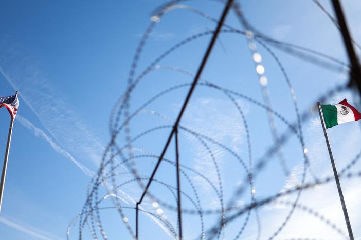 An American flag (L) and Mexican flag (R) fly along the US-Mexico border in El Paso, Texas in January 2025.