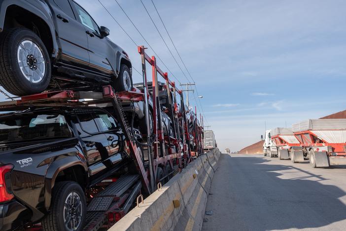 A car carrier trailer drive to cross to the U.S. at Otay Commercial port in Tijuana, Mexico on January 31. President Donald Trump's threatened tariffs on Mexico and Canada, set to go into effect on Tuesday, would hurt the Mexican economy — but also hurt auto plants in the U.S.