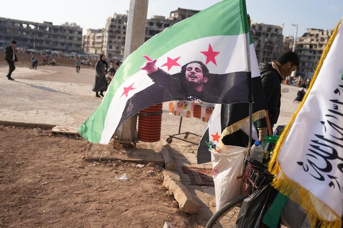 A flag with a photo of Abdel Basset al-Sarout is seen in Homs, Syria, on Jan. 31.